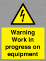 warning-work-in-progress-on-equipmentwith-electrical-hazard-symbol~
